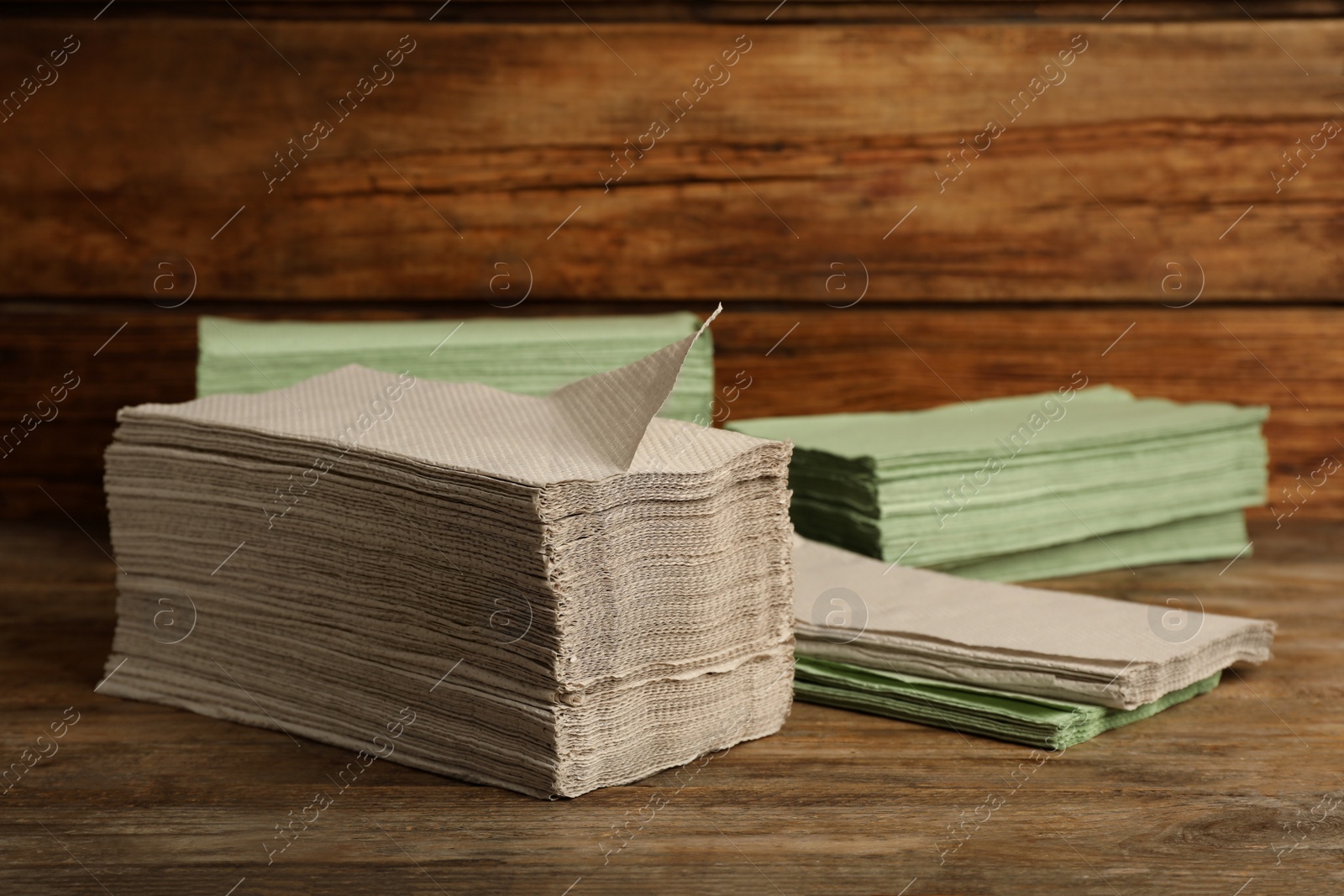 Photo of Many paper towels on wooden table. Space for text