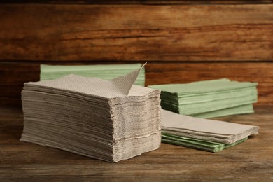 Many paper towels on wooden table. Space for text