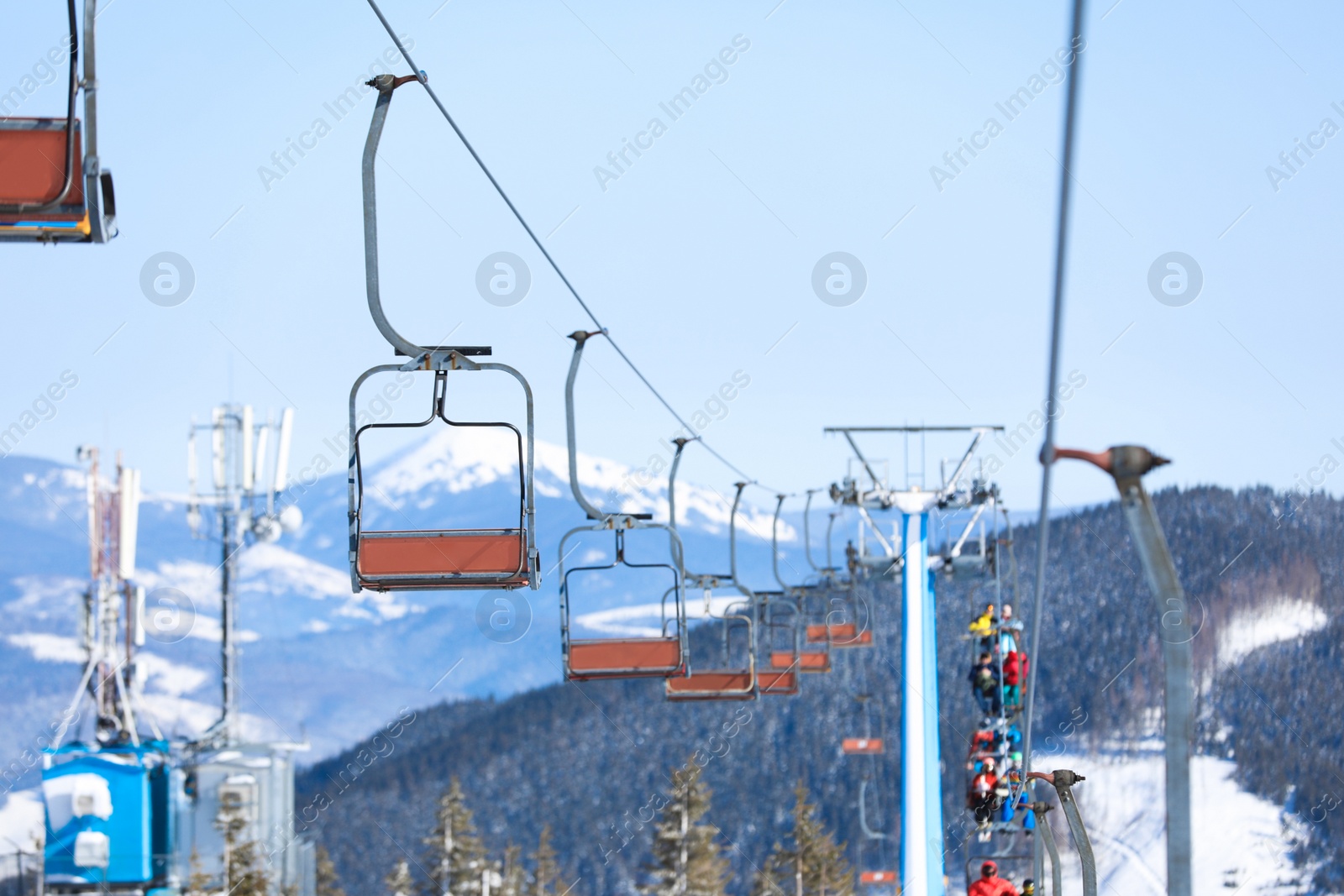 Photo of Empty chairlift at mountain ski resort. Winter vacation