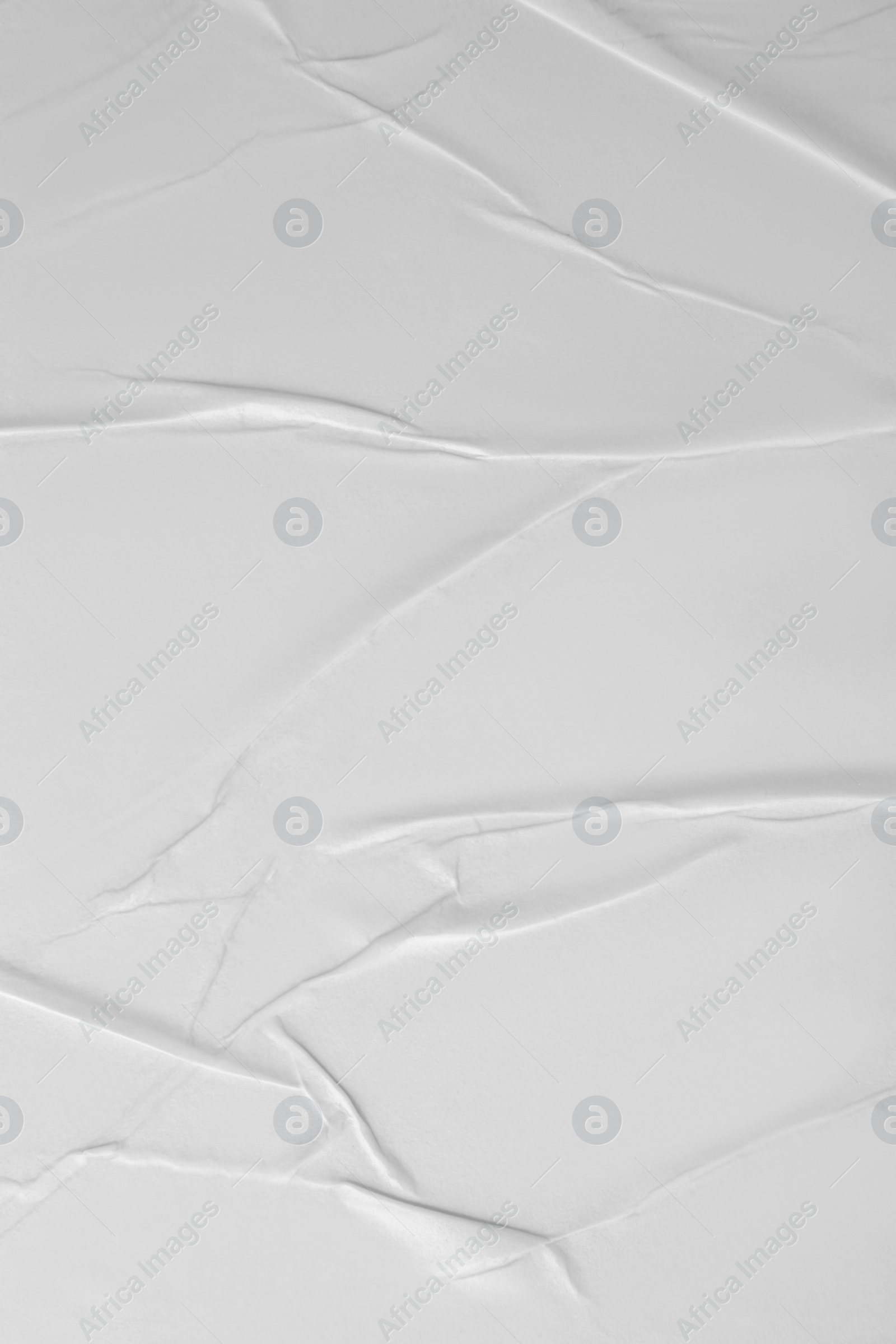 Photo of Texture of white creased paper, closeup view