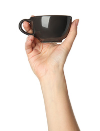 Woman holding black cup on white background, closeup