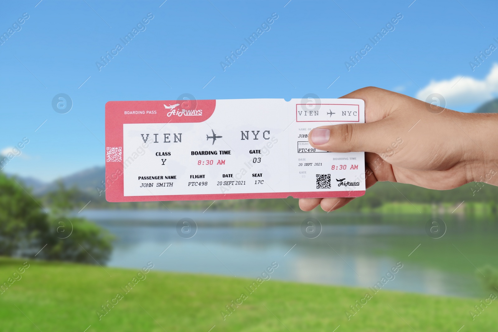 Image of Woman holding ticket near lake, closeup. Travel agency service