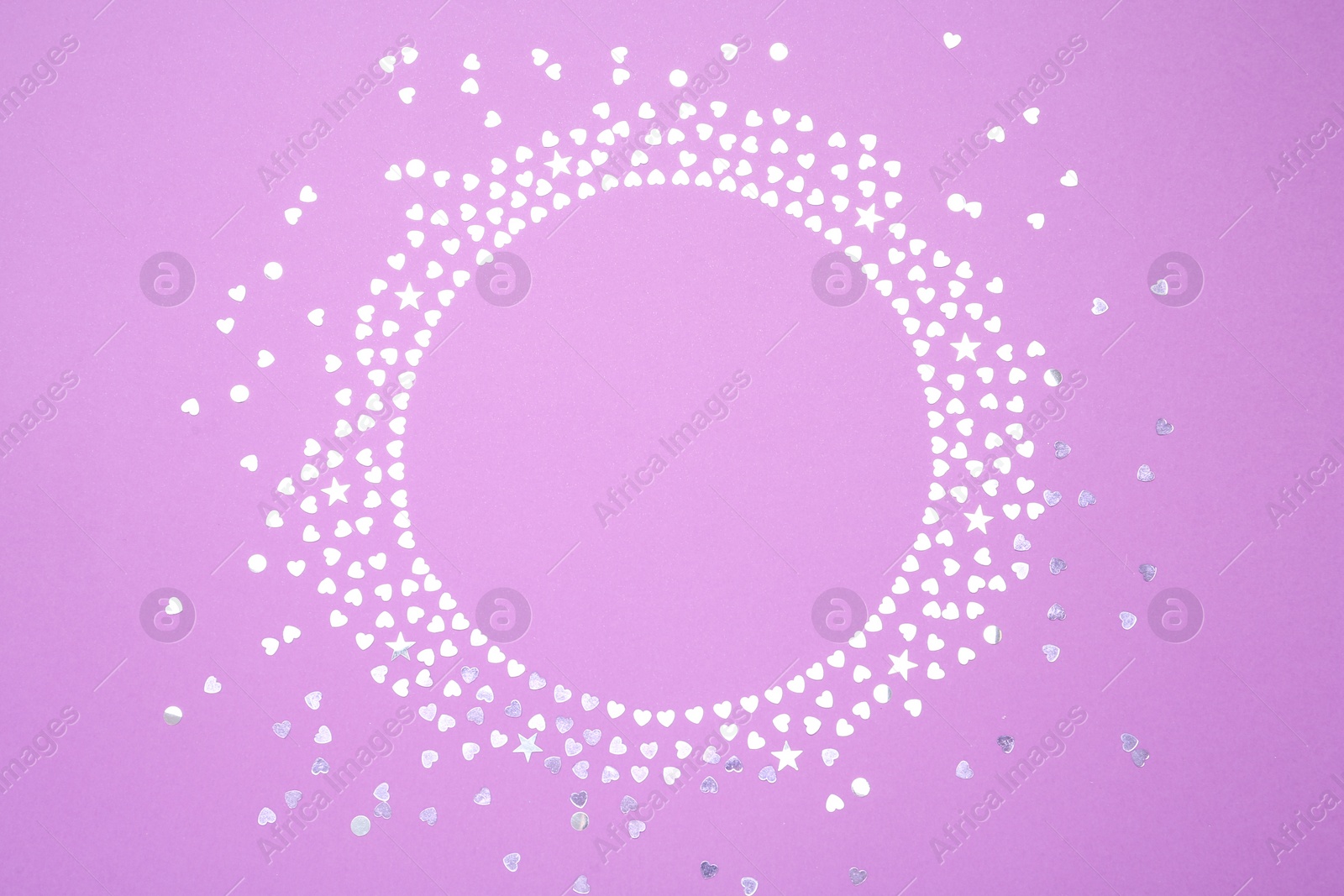 Photo of Frame made of bright confetti on violet background, flat lay. Space for text