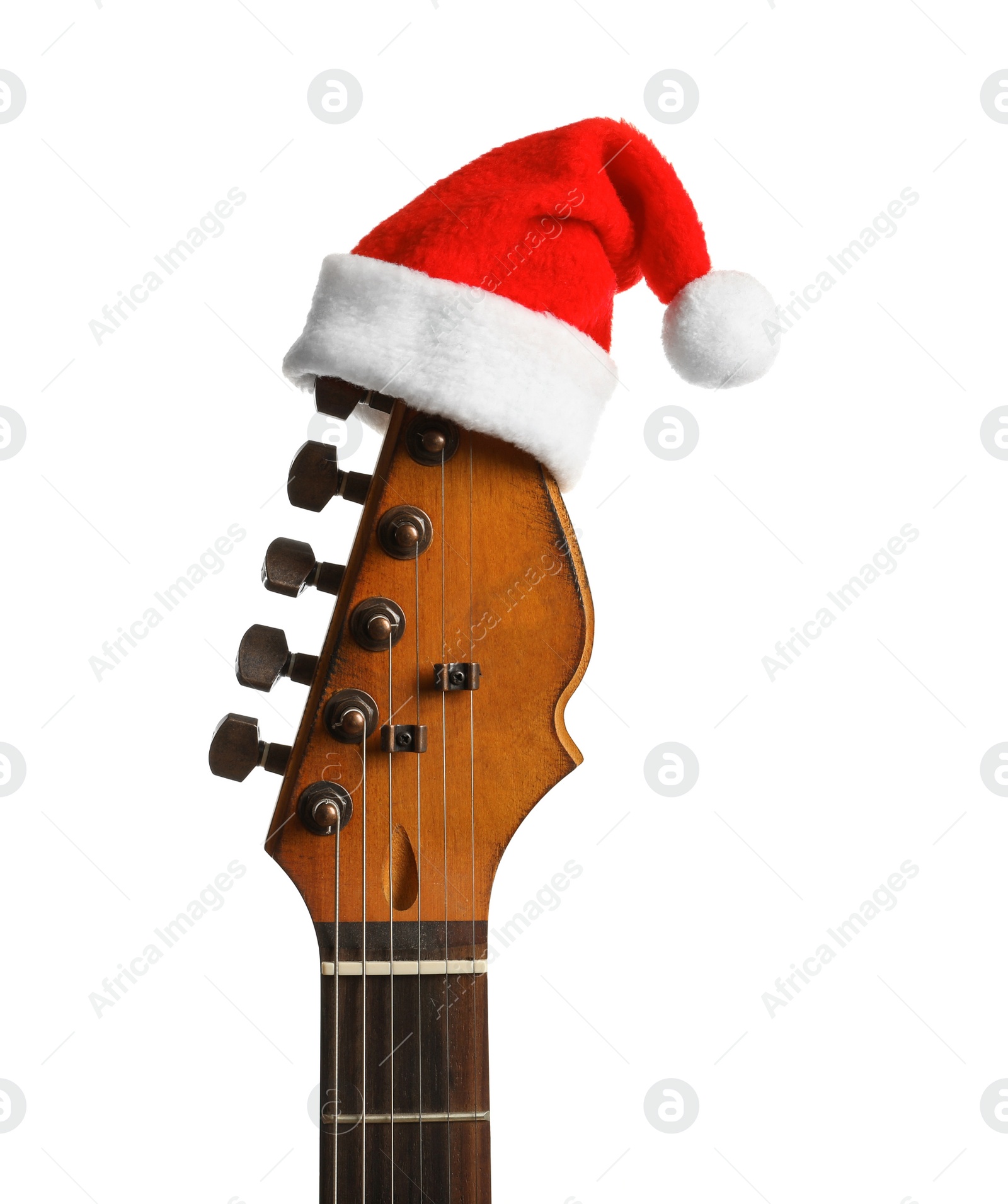 Photo of Guitar with Santa hat on white background. Christmas music concept