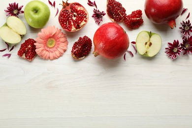 Photo of Flat lay composition with Rosh Hashanah holiday attributes on white wooden table. Space for text