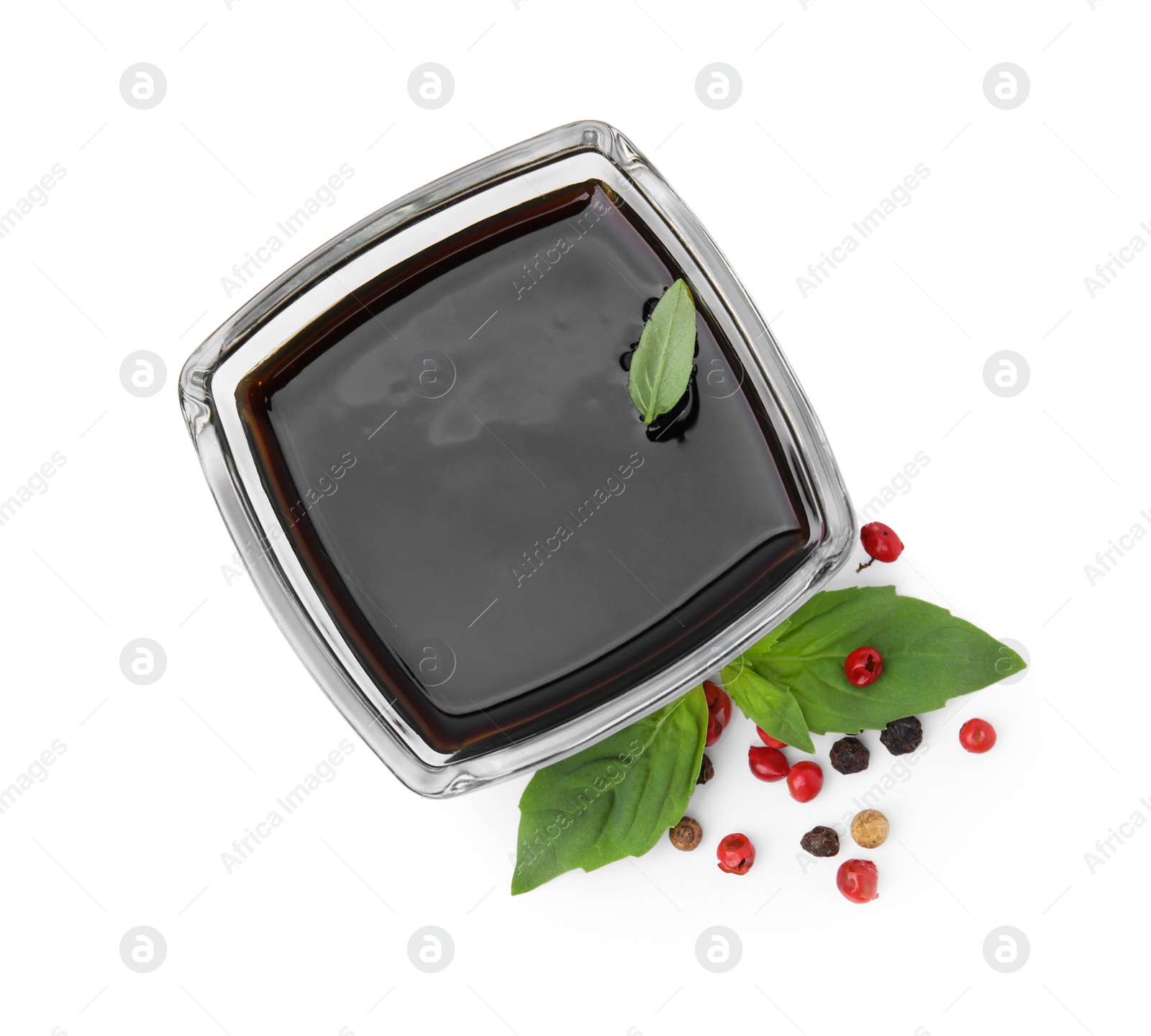 Photo of Organic balsamic vinegar, basil and pepper isolated on white, top view