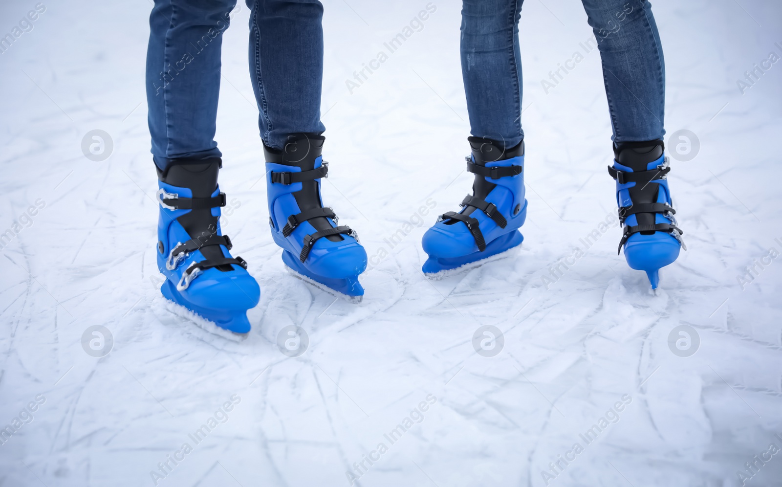 Photo of Friends at ice skating rink outdoors, closeup