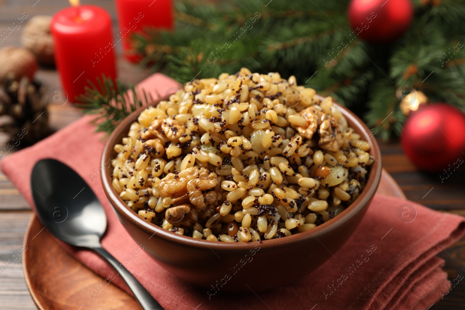 Photo of Traditional Christmas slavic dish kutia in bowl on table, closeup
