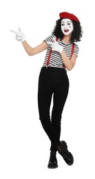 Funny mime with beret posing on white background