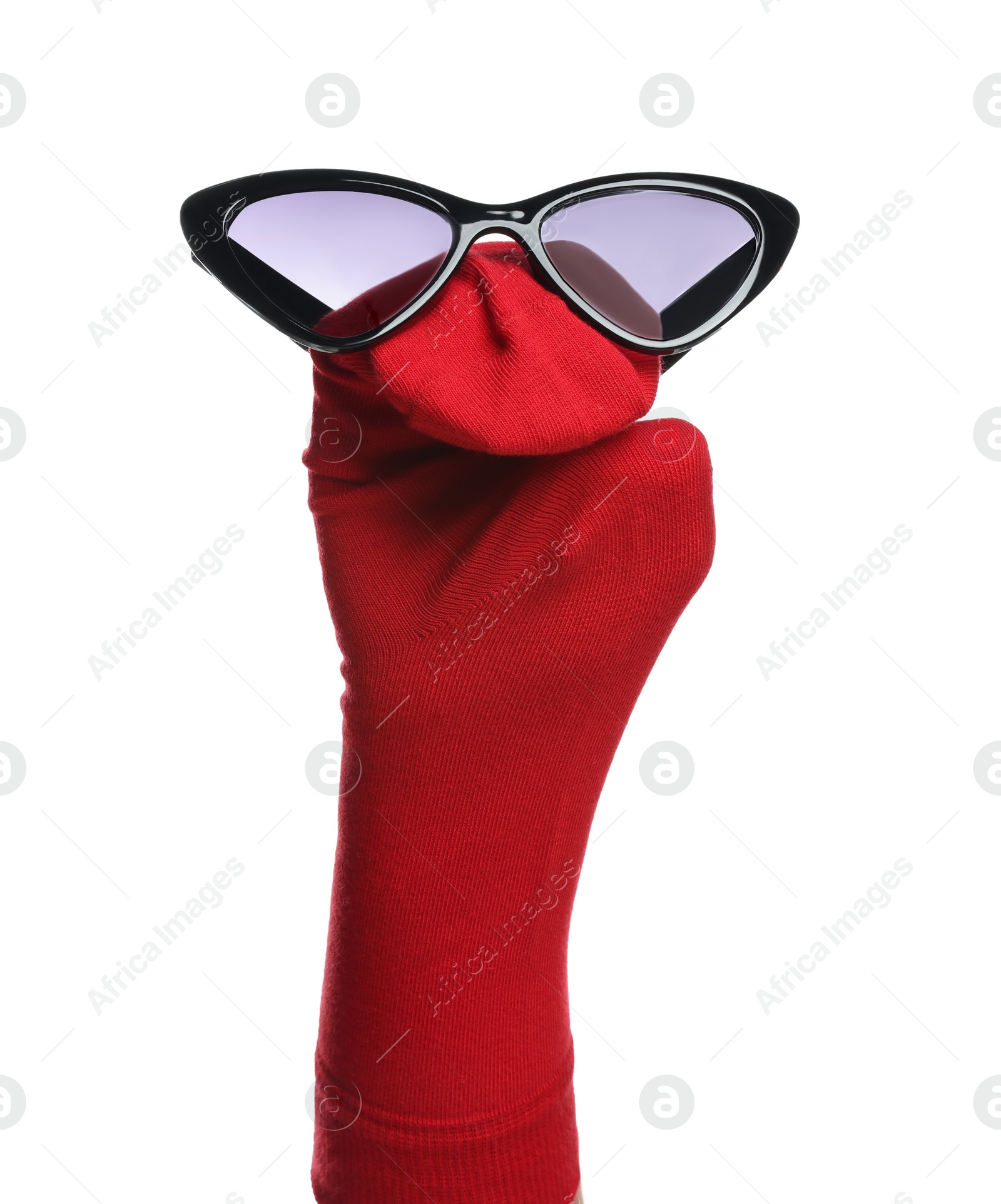 Photo of Funny sock puppet with sunglasses isolated on white