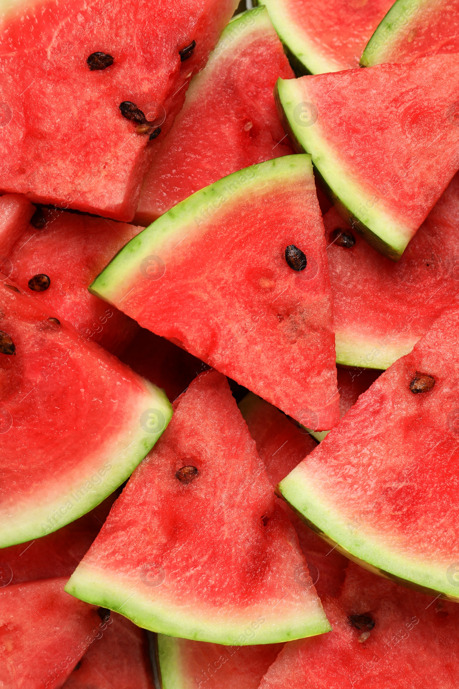 Photo of Slices of tasty ripe watermelon as background, top view