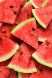 Photo of Slices of tasty ripe watermelon as background, top view