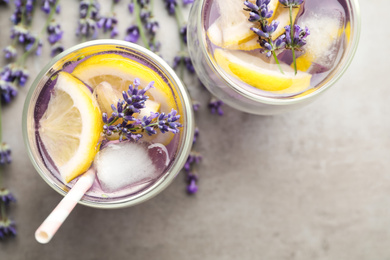 Fresh delicious lemonade with lavender on grey table, flat lay