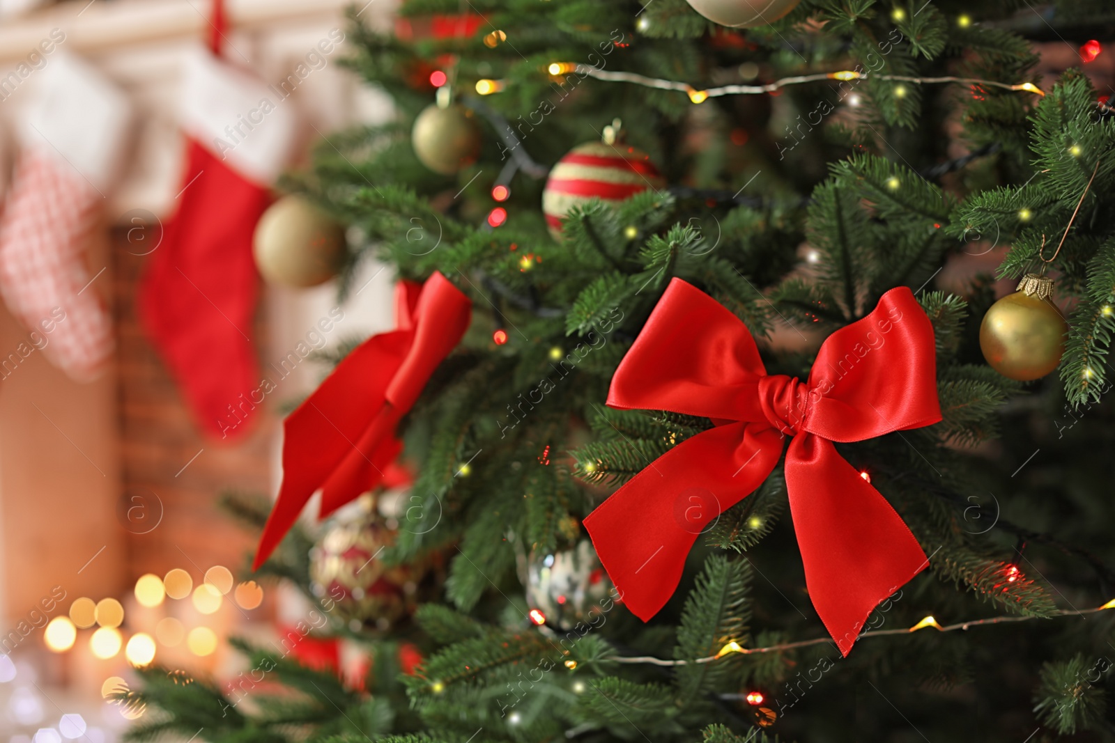 Photo of Christmas tree with stylish decor indoors, closeup