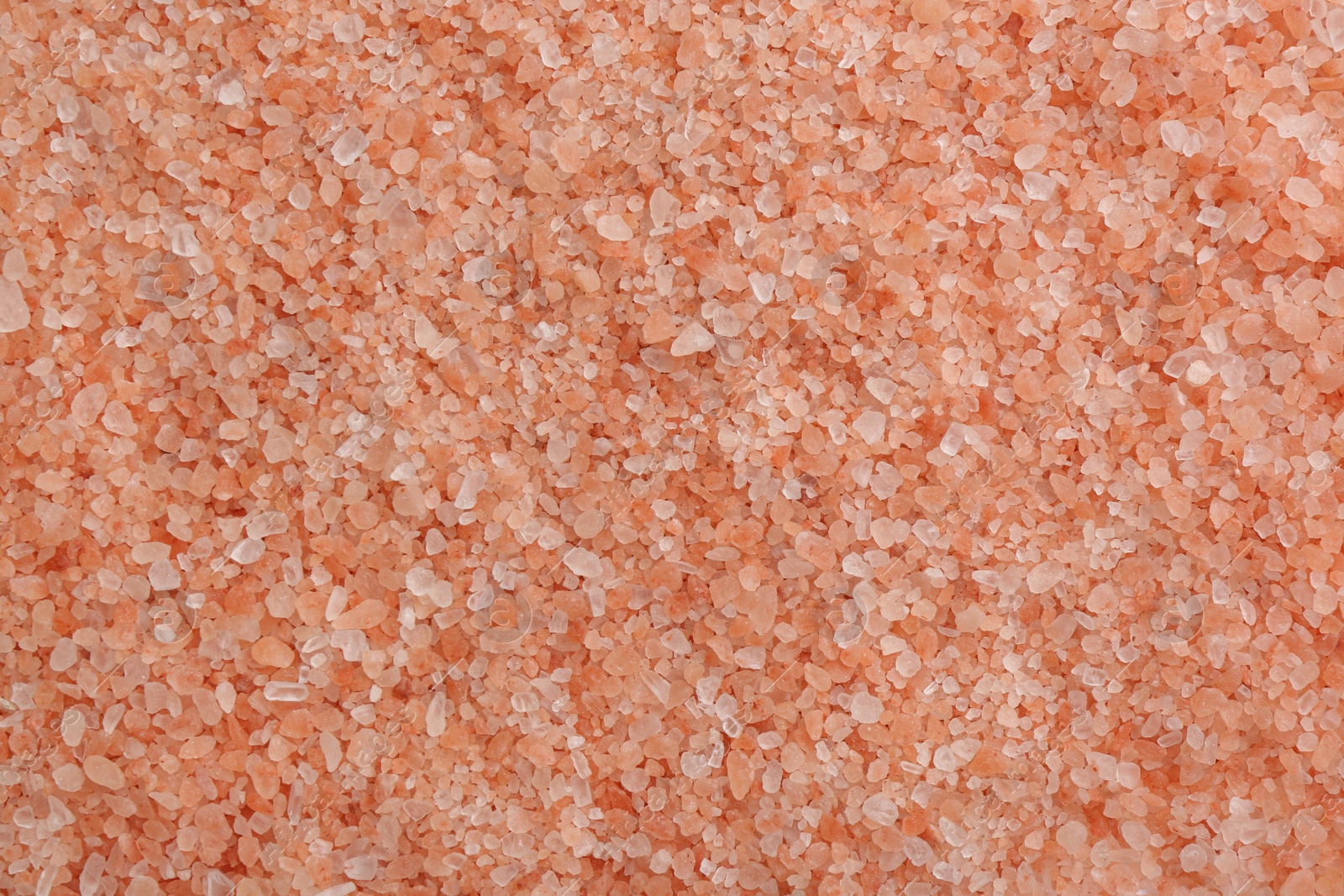 Photo of Pink himalayan salt as background, top view