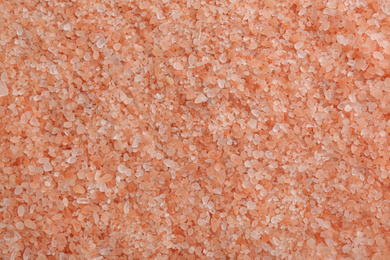 Pink himalayan salt as background, top view