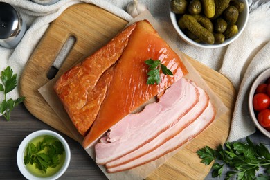 Photo of Flat lay composition with delicious smoked bacon on wooden table