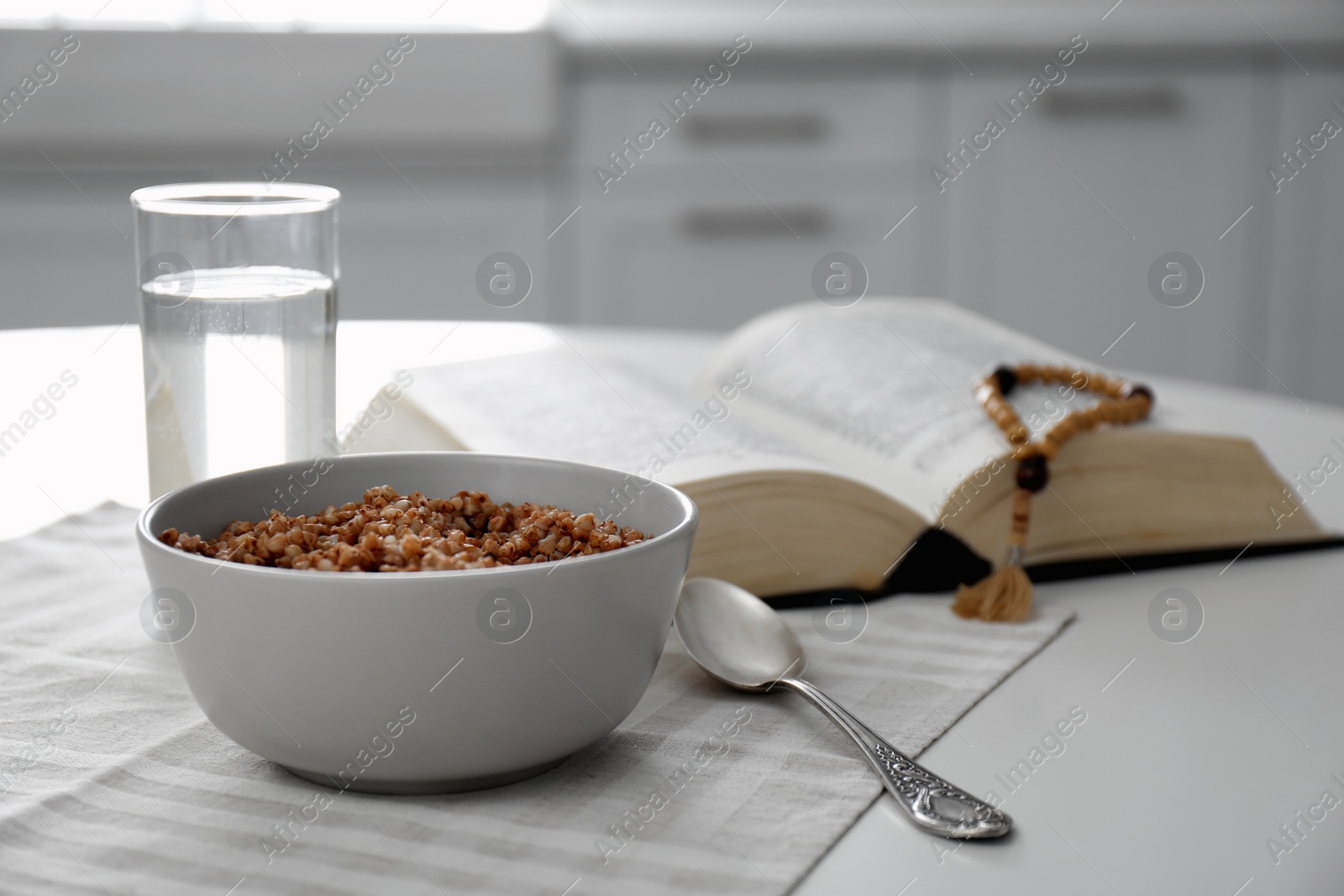 Photo of Great Lent dinner served on white table in kitchen