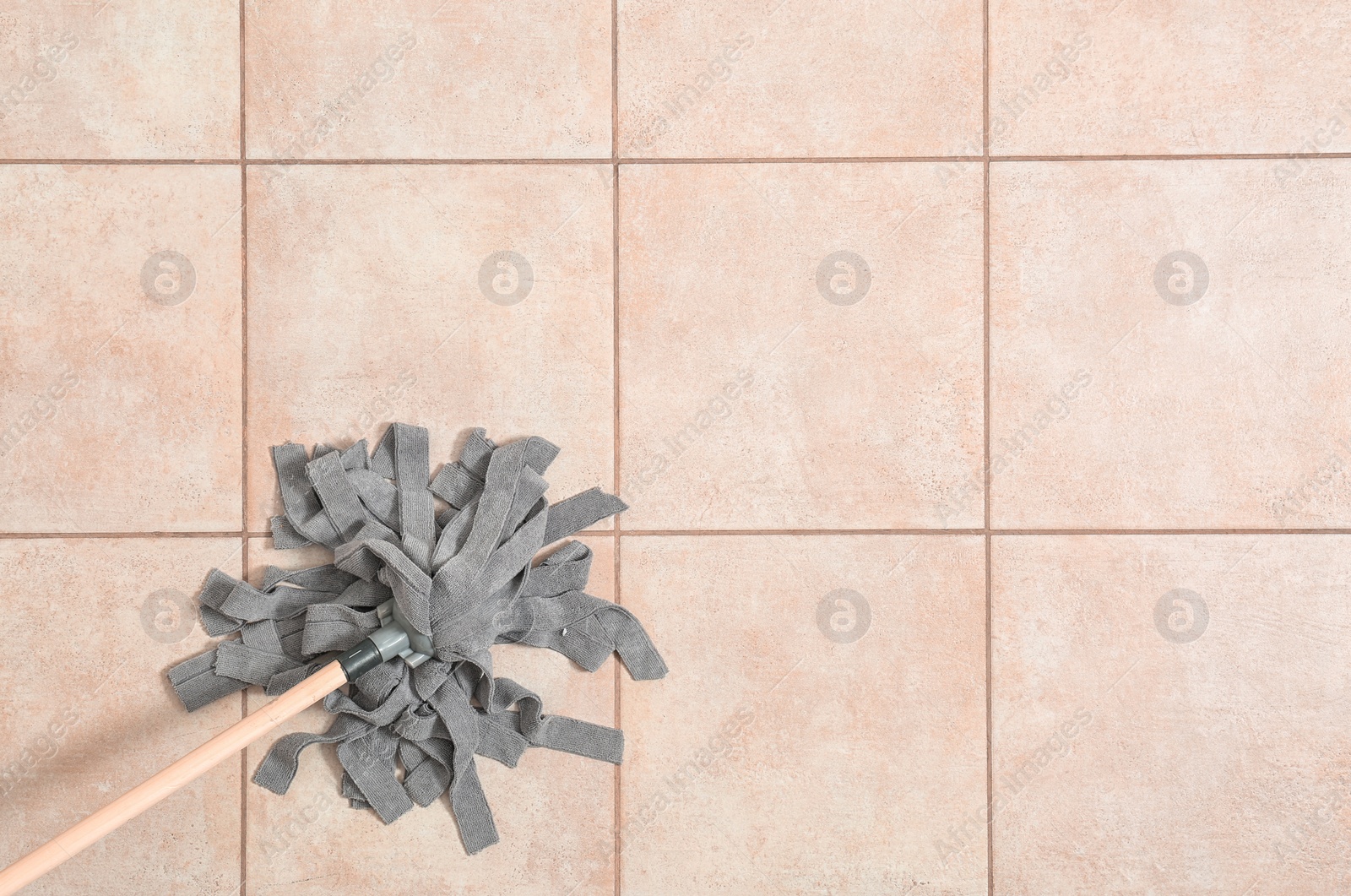 Photo of Cleaning of floor with mop, top view. Space for text