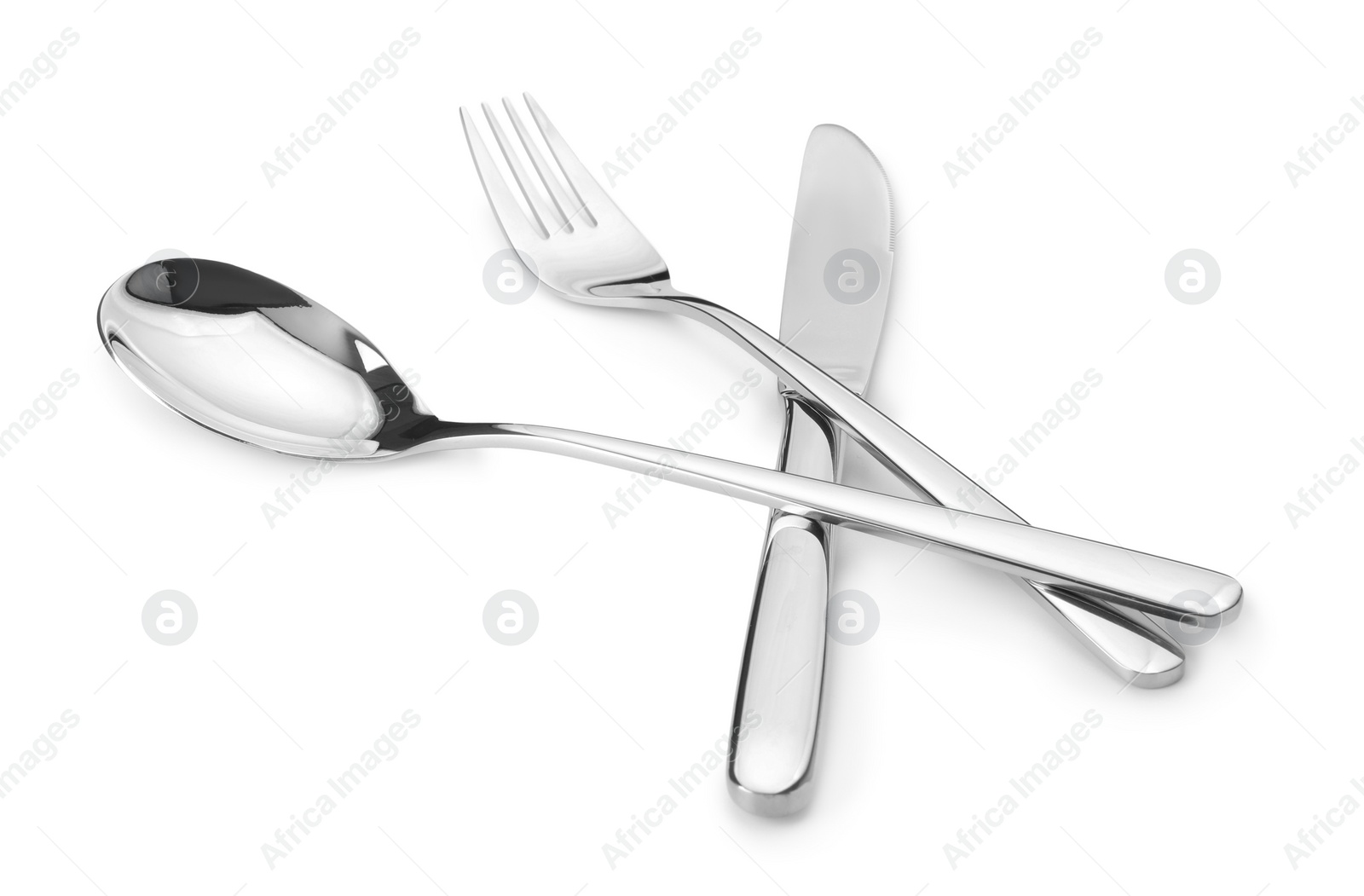 Photo of Shiny silver fork, knife and spoon isolated on white. Luxury cutlery set