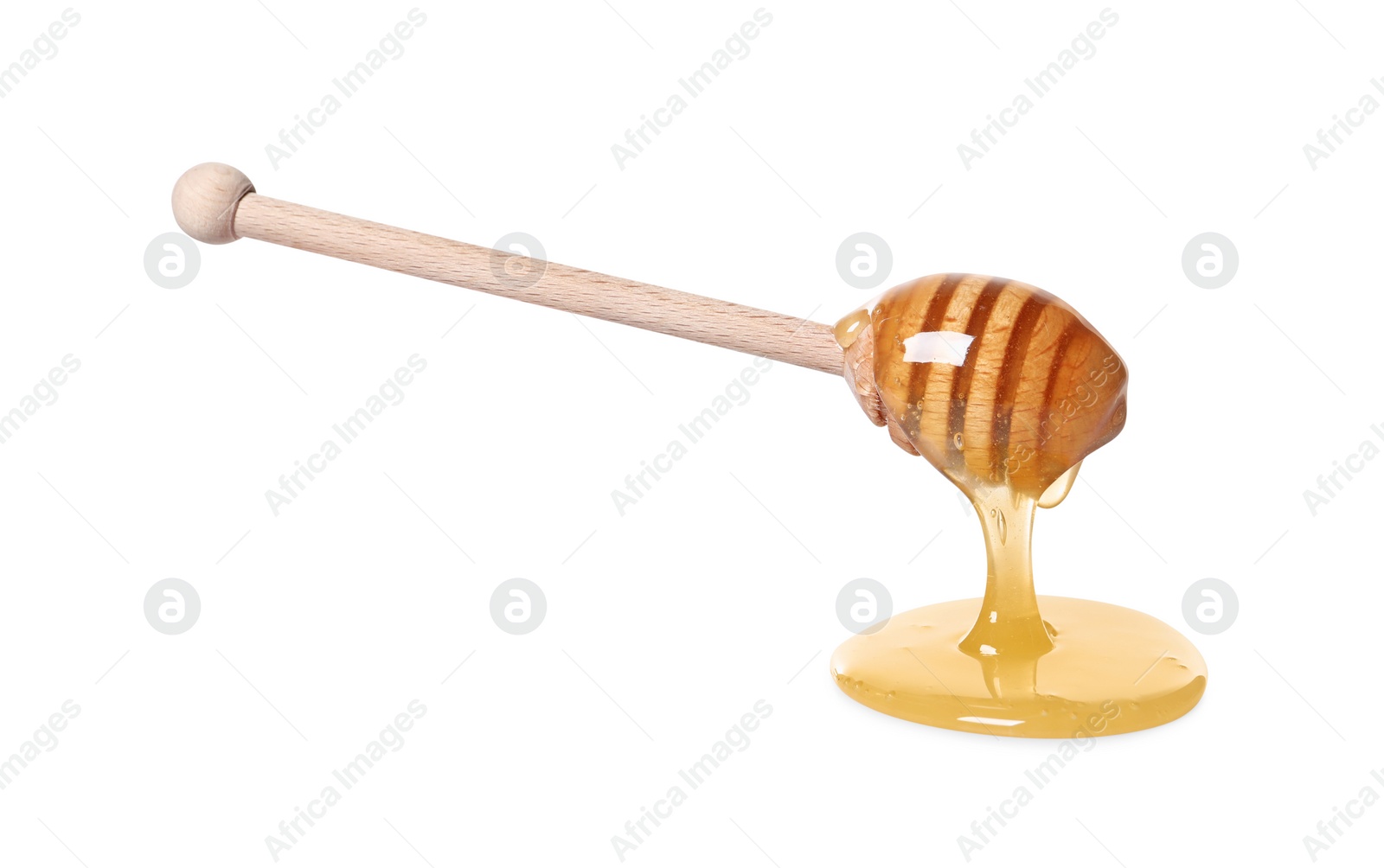 Photo of Natural honey dripping from dipper on white background