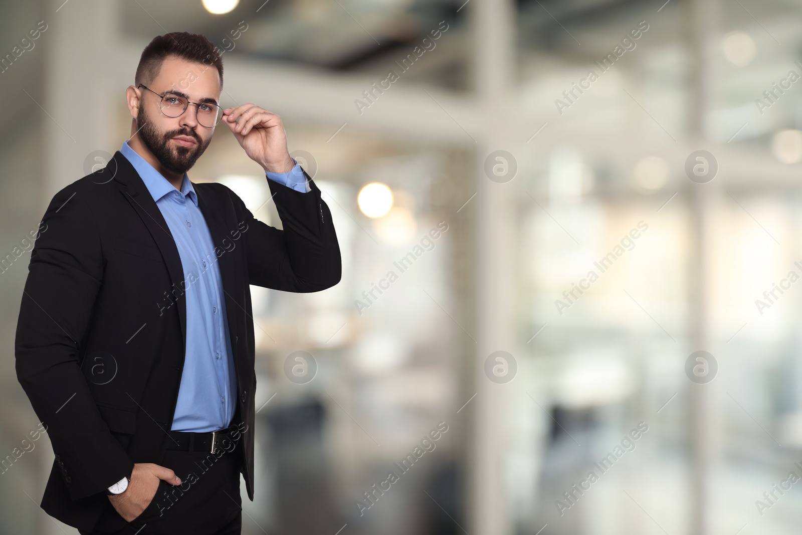 Image of Successful lawyer in glasses on blurred background, space for text