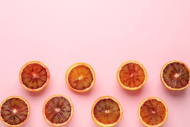 Photo of Many ripe sicilian oranges on pink background, flat lay. Space for text