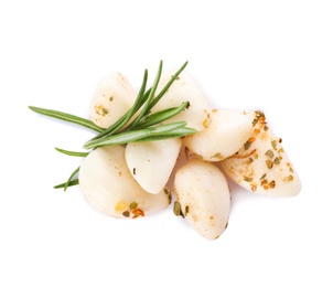 Photo of Preserved garlic with rosemary on white background, top view