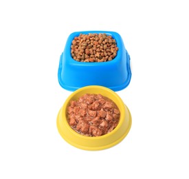 Dry and wet pet food in feeding bowls isolated on white