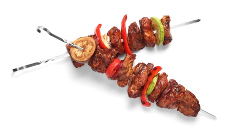 Delicious shish kebabs with vegetables isolated on white, top view