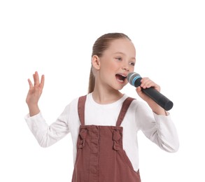 Cute little girl with microphone singing on white background
