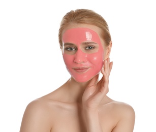 Photo of Young woman with pomegranate face mask on white background