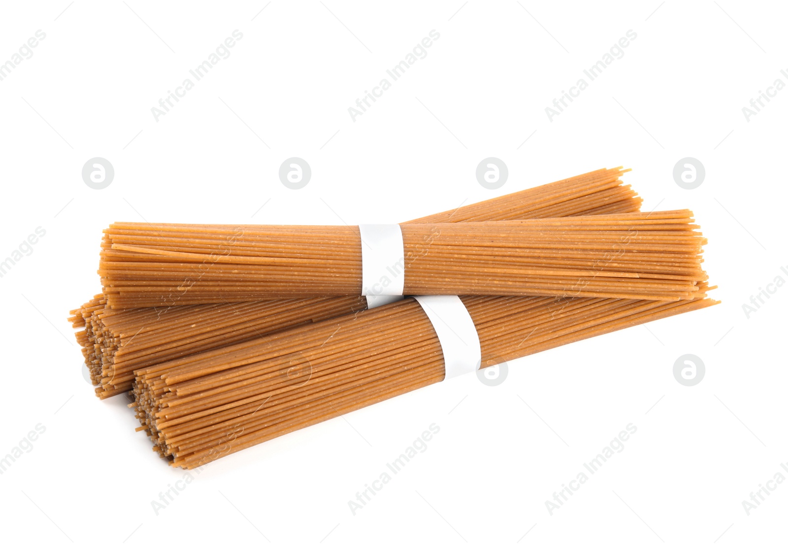 Photo of Uncooked buckwheat noodles isolated on white. Japanese cuisine