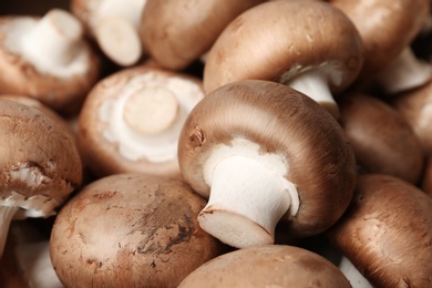 Photo of Fresh champignon mushrooms as background. Healthy food