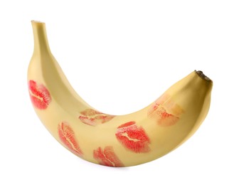 Photo of Banana covered with red lipstick marks isolated on white. Potency concept