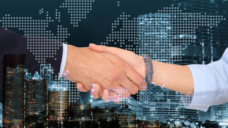 Image of Multiple exposure of partners shaking hands, coins and night city. Business values