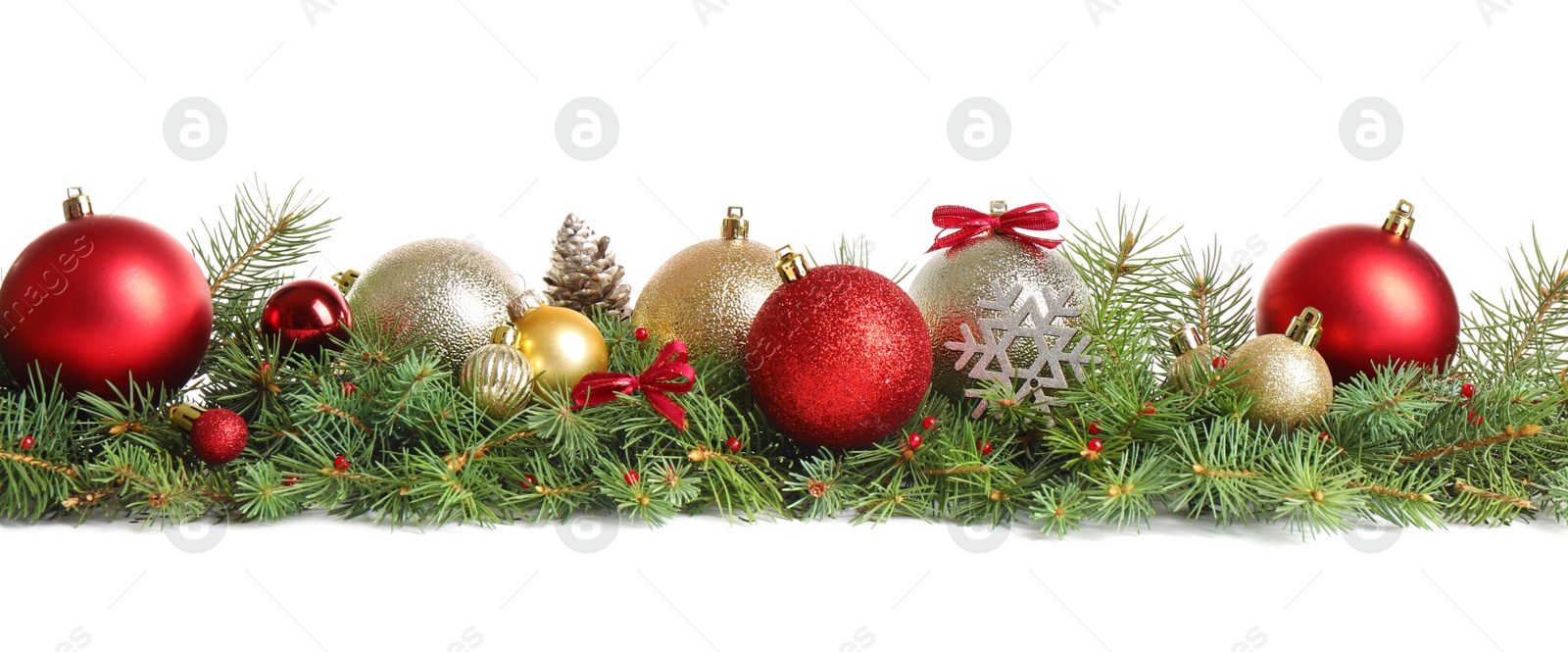 Photo of Fir tree branches with Christmas decoration on white background