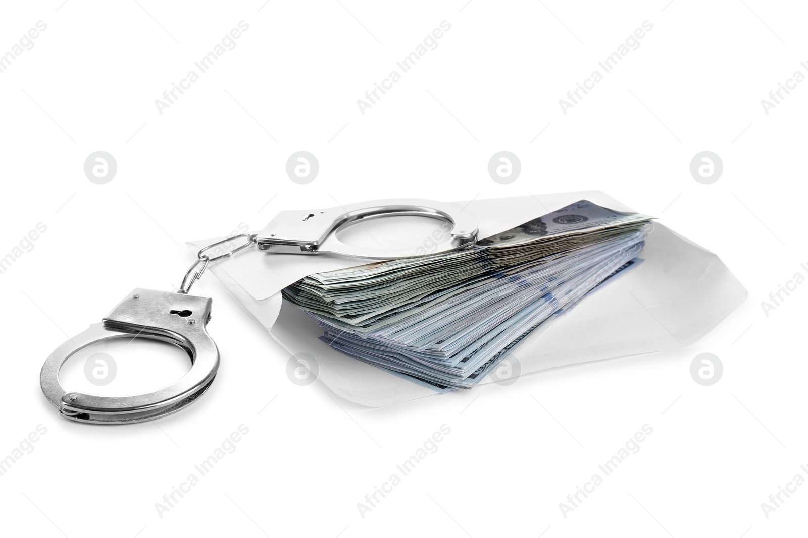 Photo of Envelope with dollar bills and handcuffs isolated on white. Bribe concept