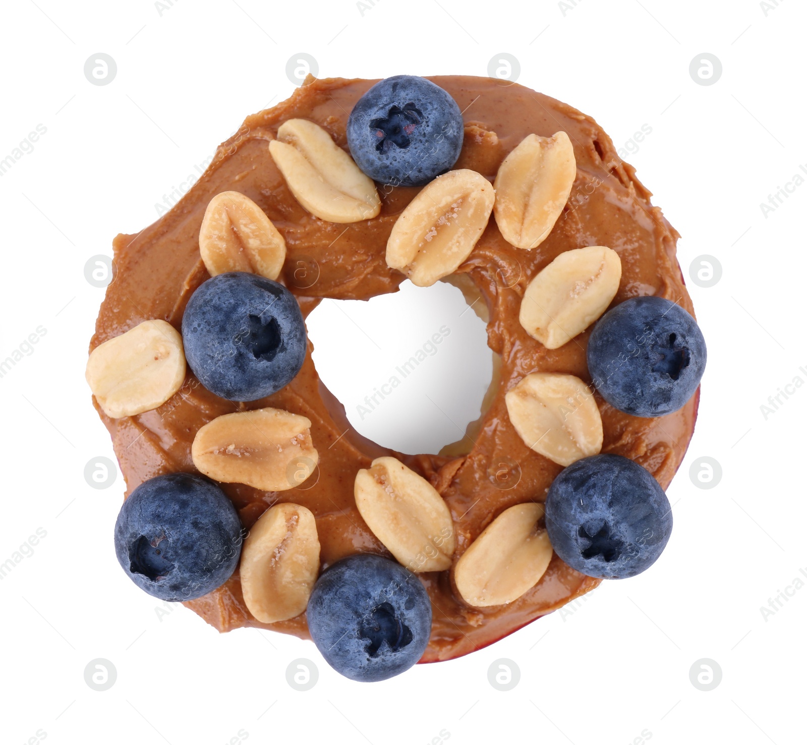 Photo of Slice of fresh apple with peanut butter, blueberries and nuts isolated on white, top view