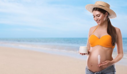 Image of Young pregnant woman with sun protection cream on beach. Space for text