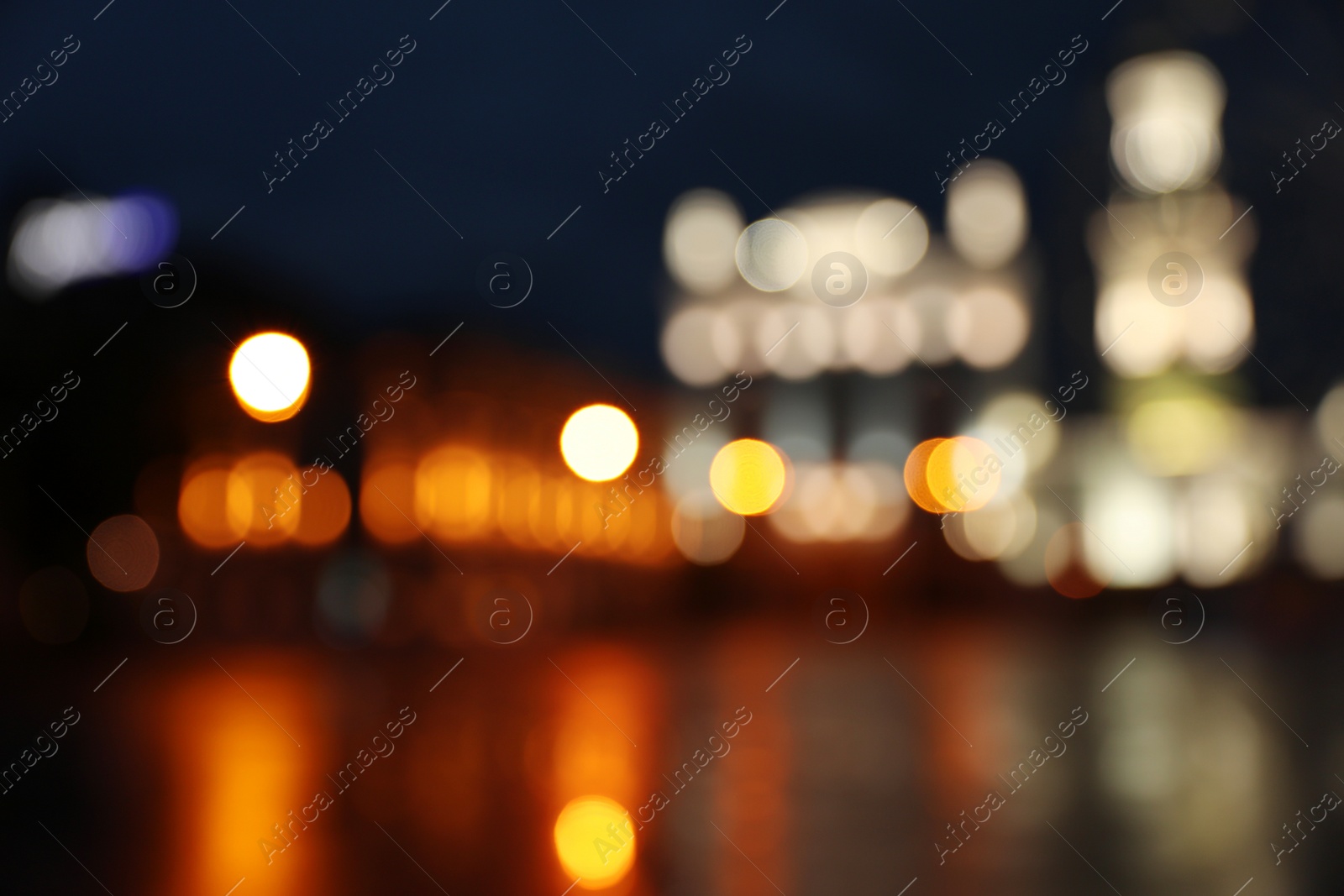 Photo of Blurred view of beautiful city at night. Bokeh effect