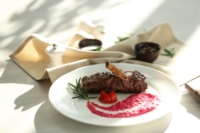 Delicious roasted rib served on white wooden table