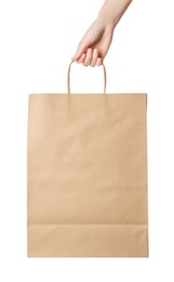 Photo of Woman holding kraft paper bag on white background, closeup. Mockup for design