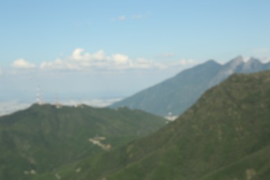 Photo of Big mountains under blue sky on sunny day, blurred view