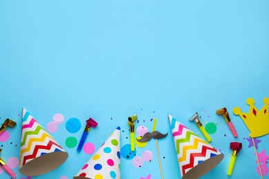 Photo of Flat lay composition with party items on light blue background, space for text