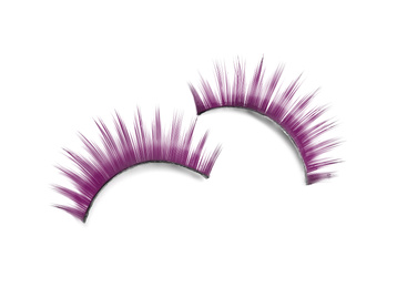 Image of Beautiful pair of purple false eyelashes on white background, top view