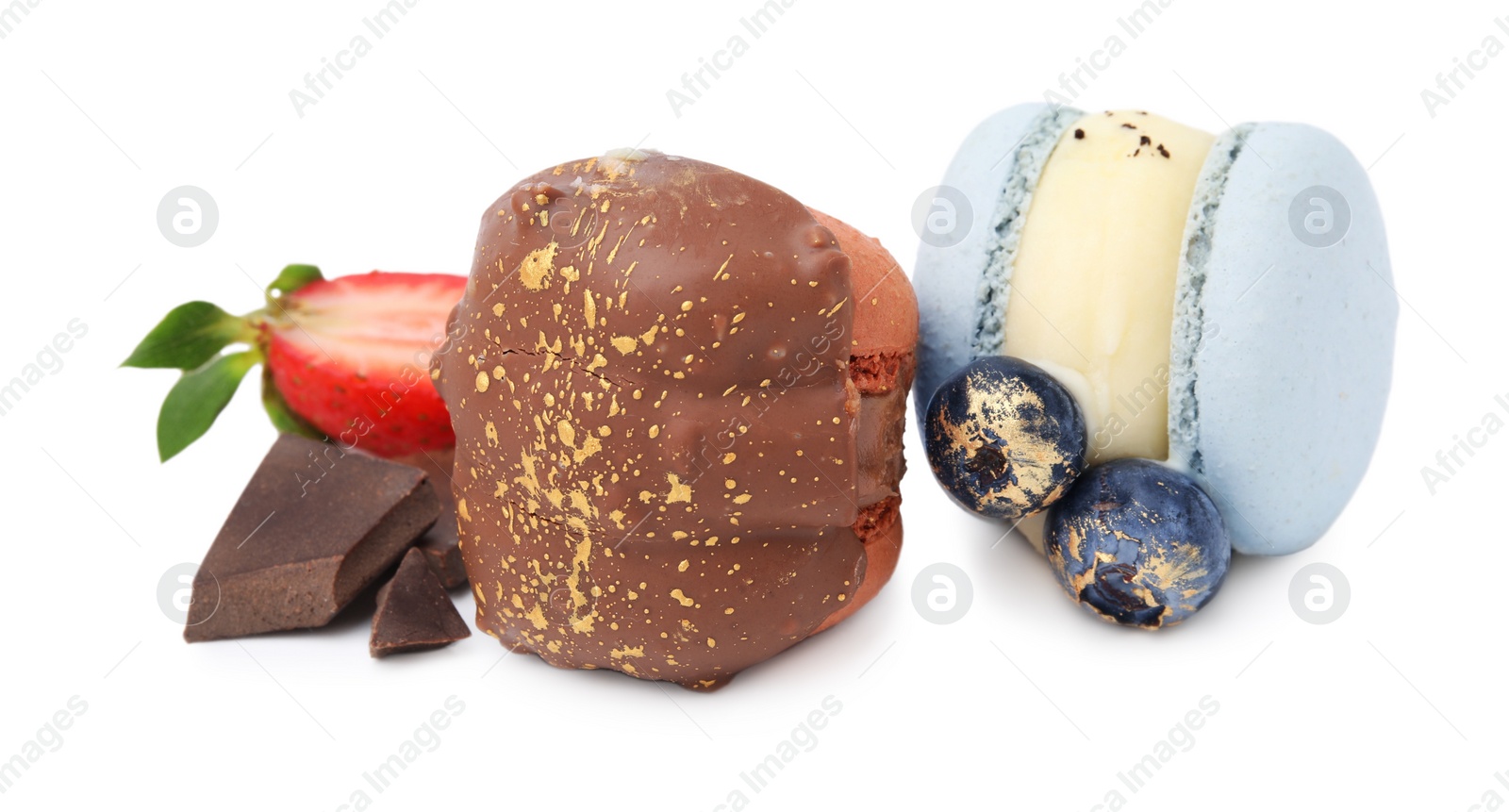 Photo of Delicious sweet macarons, berries and chocolate isolated on white