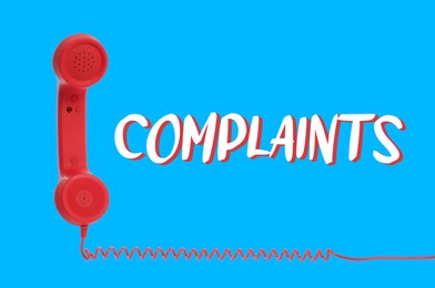 Image of Corded telephone handset and word complaints on light blue background
