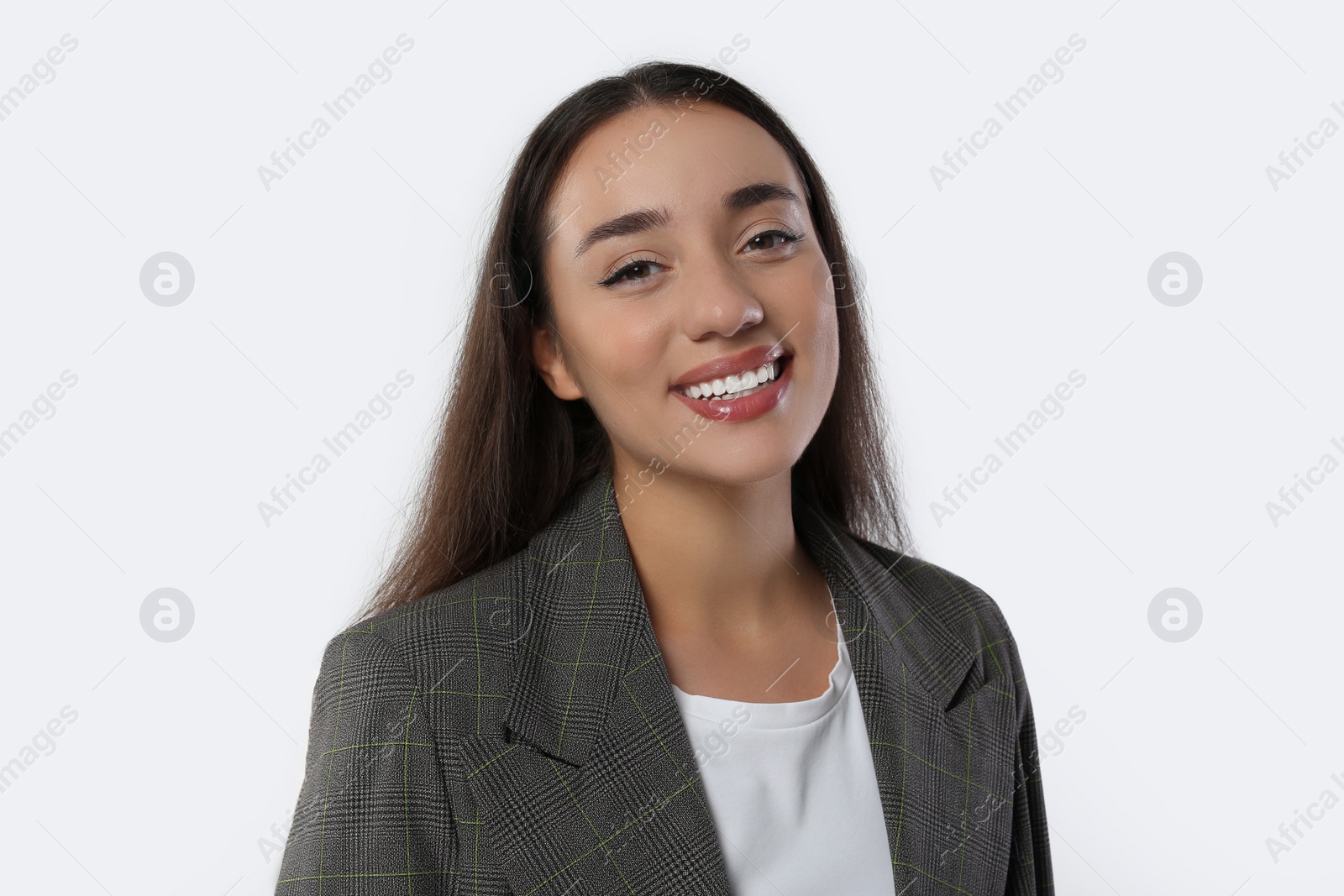 Photo of Portrait of happy young woman in stylish jacket on white background