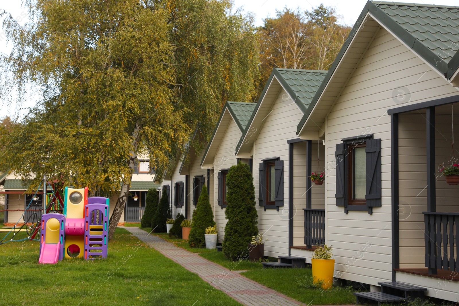 Photo of Beautiful cottage houses near playground. Real estate for rent